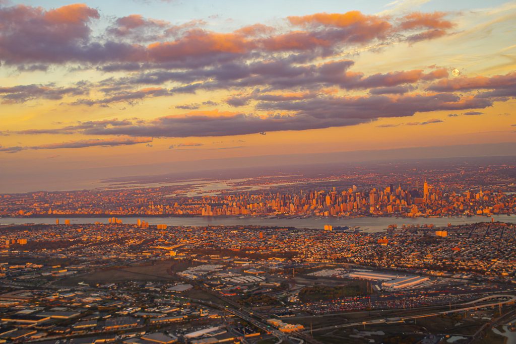 New York City at sunset image taken from an airplane after takeoff from New Wark.